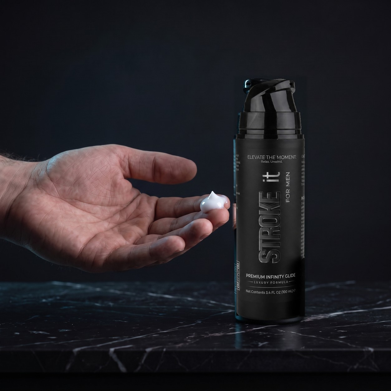 A dollop of white Stroke it cream in a hand beside the bottle